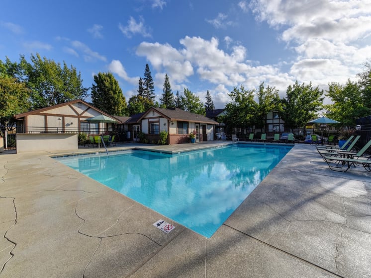 Pool Facing Office with Lounge Chairs, Lime Green Chairs and Patio Umbrella